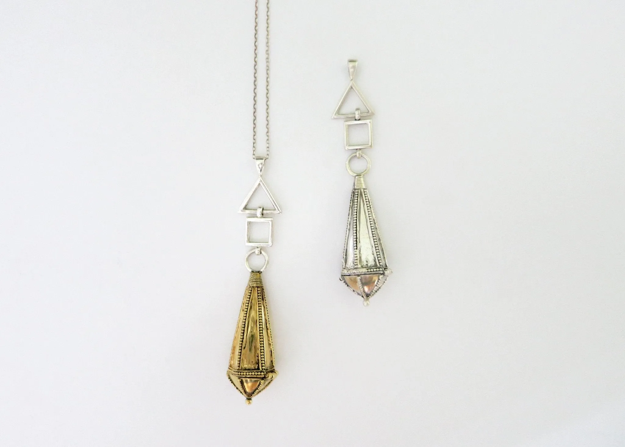 Unique, bi-metal, long amuletic pendant, in gold-plated brass and sterling silver